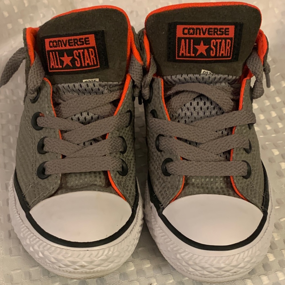 Converse Junior kid’s low top sneakers, orange and gray, size 12.